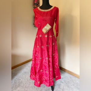 Full 50 length red ray silk frock with panels .